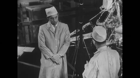 EL SEGUNDO - 1966 - Fitch asks Roderick why does the Surveyor spacecraft need to Stock Footage 296398907