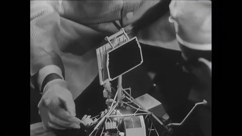 EL SEGUNDO - 1966 - Robert C. Roderick shows the solar panel of the Surveyor Stock Footage 296396190