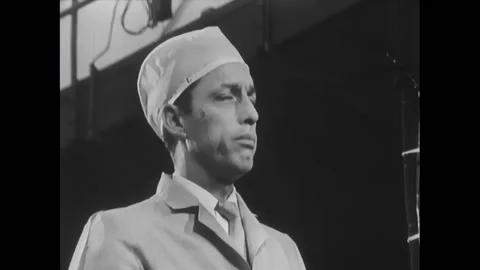 EL SEGUNDO - 1966 - Roderick explains to Fitch that they adjust the midcore Stock Footage 296409105