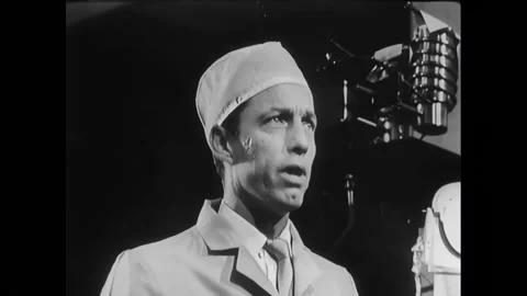 EL SEGUNDO - 1966 - Surveyor project director Robert C. Roderick shows John Stock Footage 296409093