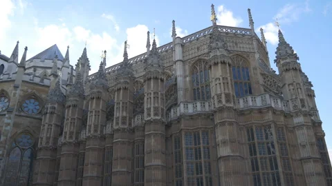 Elaborate Gothic facade and spires of Westminster Abbey under a blue sky. Stock Footage 342042244