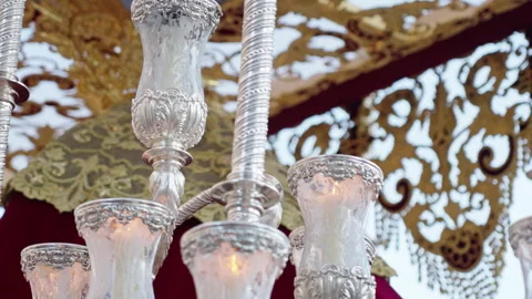 Elaborate silver candelabra illuminating a Holy Week procession float Stock Footage 333915890