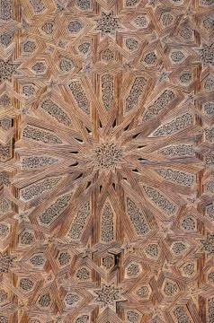 Elaborate star texture pattern on wooden door of mosque in Fez, Morocco, North Stock Photos