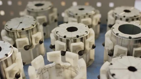 Elastic Shaft Couplings with Polymer Spiders in Rows, Machine Component Detail Stock Footage 340358330