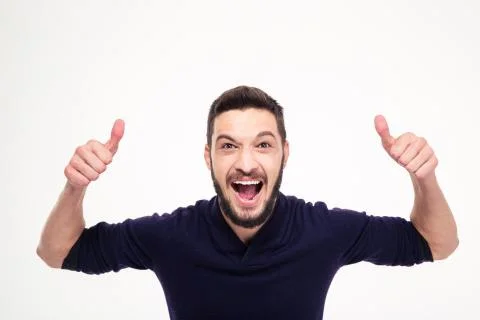 Elated excited young happy man shouting and showing thumbs up Stock Photos