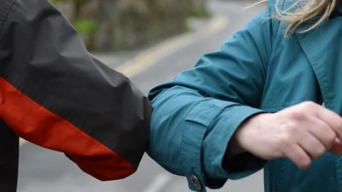 Elbow bump, greeting to avoid spread of coronavirus Stock Footage 126673503