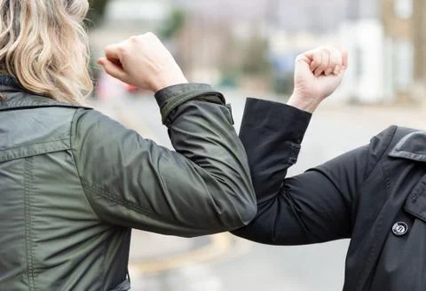 Elbow bump. Novel greeting to avoid spread of coronavirus Foto stock