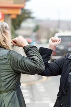 Elbow bump. Novel greeting to avoid spread of coronavirus Fotos Stock