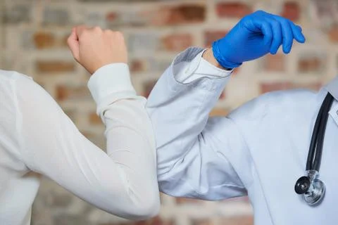 Elbow bumping to avoid the spread of coronavirus Stock Photos