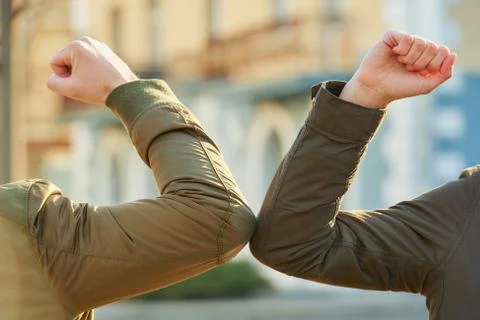 Elbow greeting to avoid the spread of coronavirus Stock Photos
