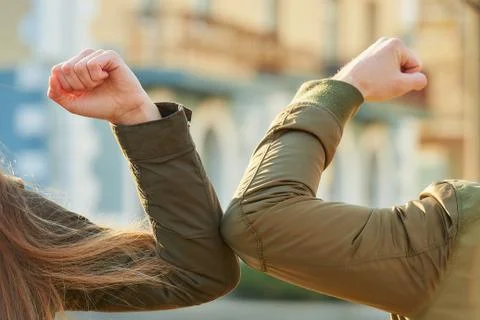 Elbow greeting to avoid the spread of coronavirus Stock Photos