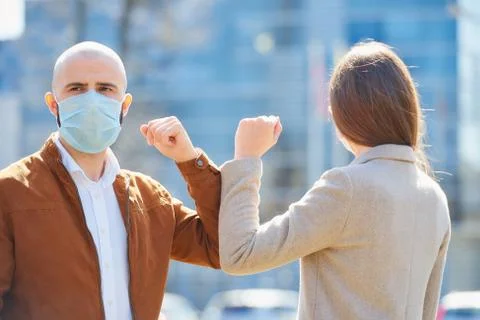 Elbow greeting to avoid the spread of coronavirus Stock Photos