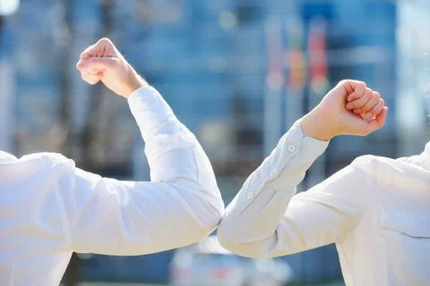 Elbow greeting to avoid the spread of coronavirus Stock Photos
