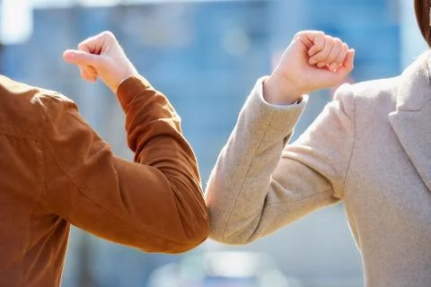 Elbow greeting to avoid the spread of coronavirus Stock Photos