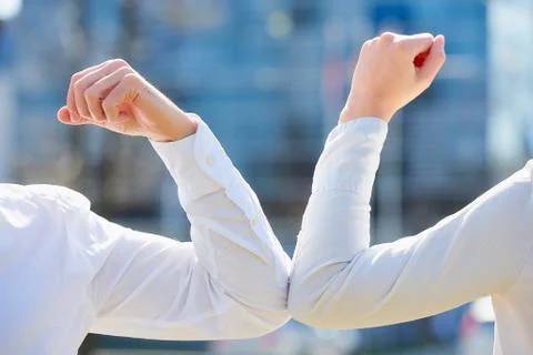 Elbow greeting to avoid the spread of coronavirus Stock Photos