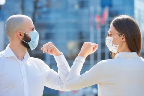 Elbow greeting to avoid the spread of coronavirus Stock Photos