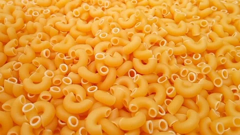 Elbow Macaroni Pasta Dropping on Uncooked Elbow Macaroni Ingredient, Food 動画素材 333667475