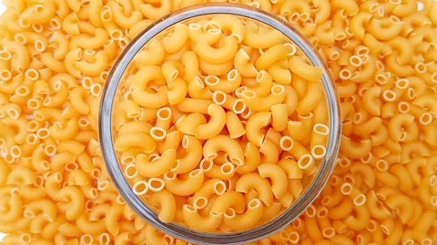 Elbow Macaroni Pasta Rotating Background, Uncooked Elbow Macaroni Pasta 動画素材 333667506