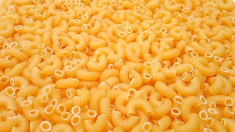 Elbow Macaroni Pasta Rotating Background, Uncooked Elbow Macaroni Pasta Vídeos de archivo 333667508