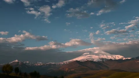 Elbrus mount with pink clouds at sunrise timelapse. Video stock 219962859