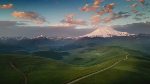 Elbrus mountain with pink clouds at sunrise. Video stock 232198953