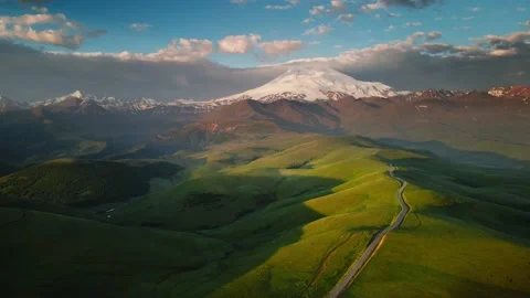 Elbrus mountain with pink clouds at sunrise. Video stock 232198998