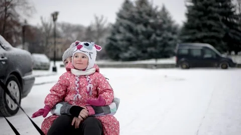 Elder Brother Pulled His Younger Sisters on a Sled Vídeo Stock 71795577