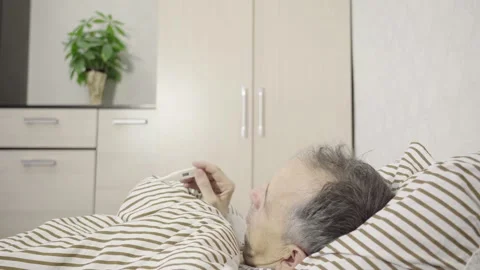The Elder Holds the Thermometer Stock Footage 151397451