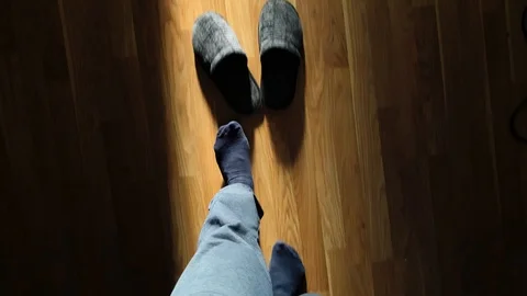 Elder man with prostate problems putting on slippers POV slow motion HD Stock Footage 105544618