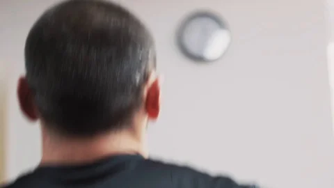 The elder man running on the treadmill back close up shot Stock Footage 123150018