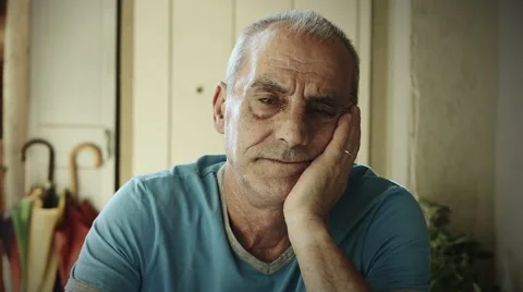 Elder man is sitting alone thinking about troubles: thoughtful, sad, sadness, 4k Stock Footage 41756378
