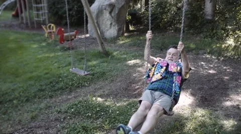 Elder man on a swing Stock-Footage 58736922