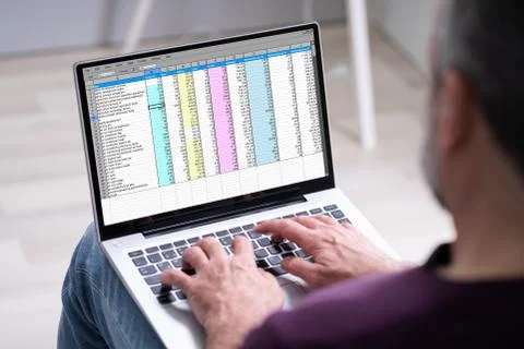 Elder Man Using Spreadsheet Data On Laptop Computer Stock Photos