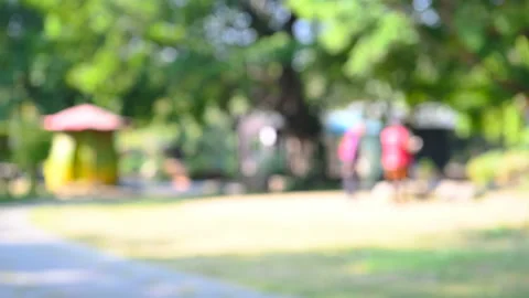 Elder people doing exercise in a park in the morning at blurred focus Stock Footage 122181352