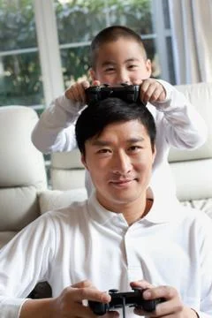 Elder Vertical composition Boy Focus. Children Father Oriental figures Stock Photos