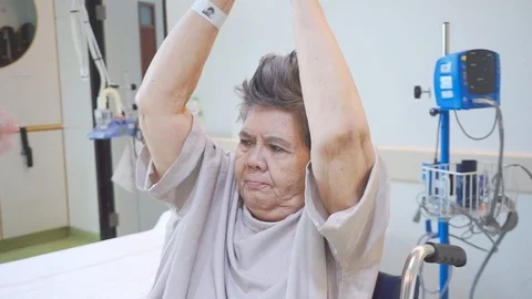 The elderly are training Raise arms to do physical therapy in the hospital. Stock Footage 124939705