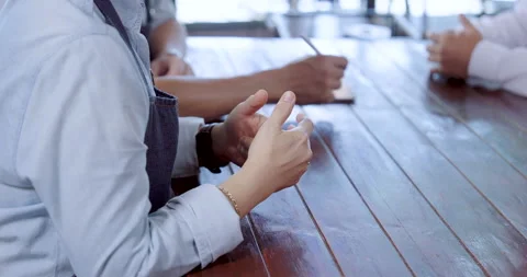 Elderly asian owners gesture while explaining service details, teamwork Stock Footage 326376210