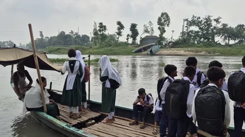 Elderly Boatman Rowing School Students On Wooden Ferry Boat 動画素材 337922723