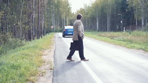 An elderly businessman in a jacket and a briefcase came by taxi, the car was Stock Footage 101508210
