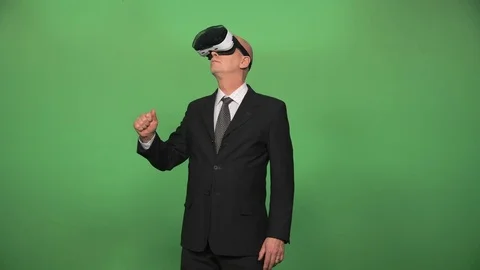 Elderly businessman using VR glasses Stock Footage 74720794