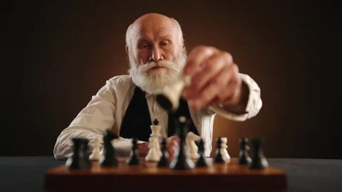 Elderly Chess Enthusiast Confidently Capturing Crucial Piece Stock Footage 263300260