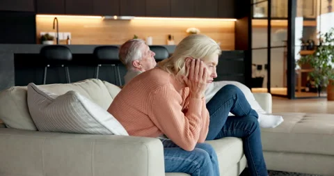 Elderly, couple and divorce with separation on sofa for argument, fight or Vídeos de archivo 337038768