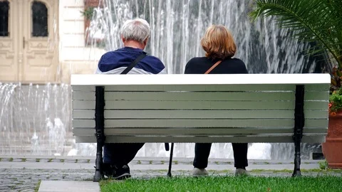 Elderly couple on a bench Stock Footage 91861197