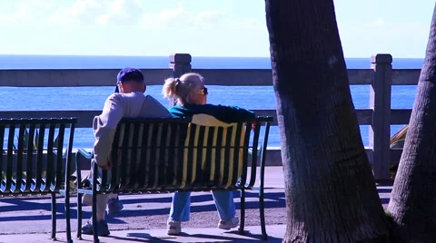 ELDERLY COUPLE ON BENCH AT OCEAN Video stock 948294
