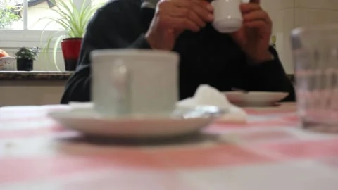 Elderly couple enjoying a hot coffee at home Stock Footage 295550053
