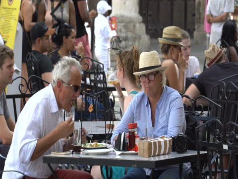 Elderly couple handsome beautiful man and woman have a lunch at cafe summer Stock Footage 69759341
