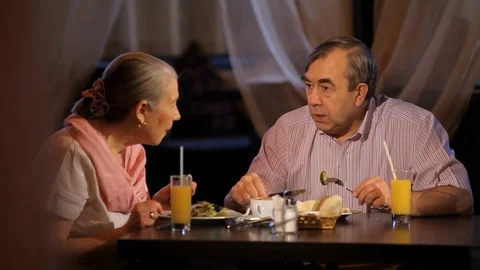 An elderly couple has dinner Stock Footage 100239657