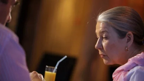 An elderly couple has dinner Stock Footage 100240895