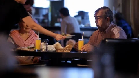 An elderly couple has dinner Stock Footage 100242209