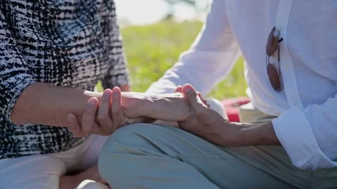 Elderly couple holding hands, expressing love and care Stock Footage 309366644